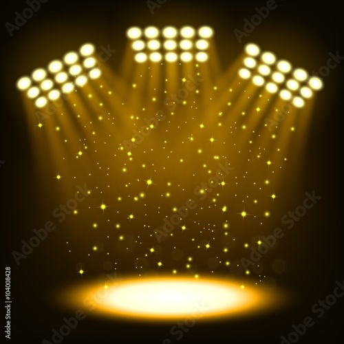Bright stadium spotlights on dark gold background