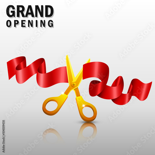 Grand opening with red ribbon and gold scissors