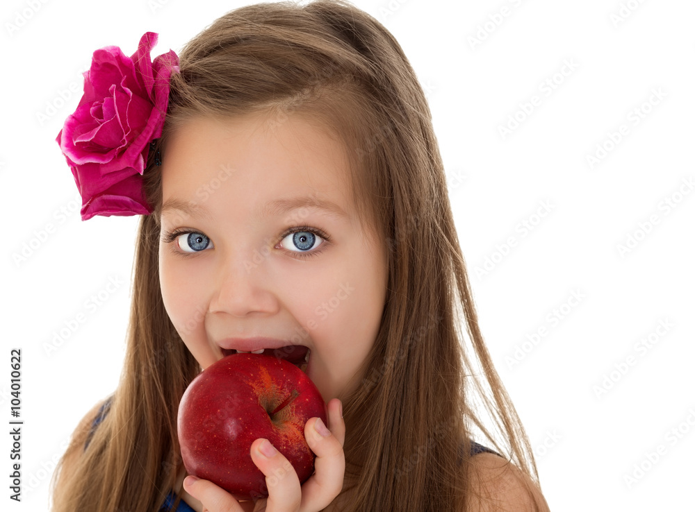 Beautiful girl with a rose stabbed in long blond hair, a bite from a large red Apple.Close-up - Isolated on white background Beautiful girl with a rose stabbed in long blond hair, a bite from a large red Apple.Close-up - Isolated on white background