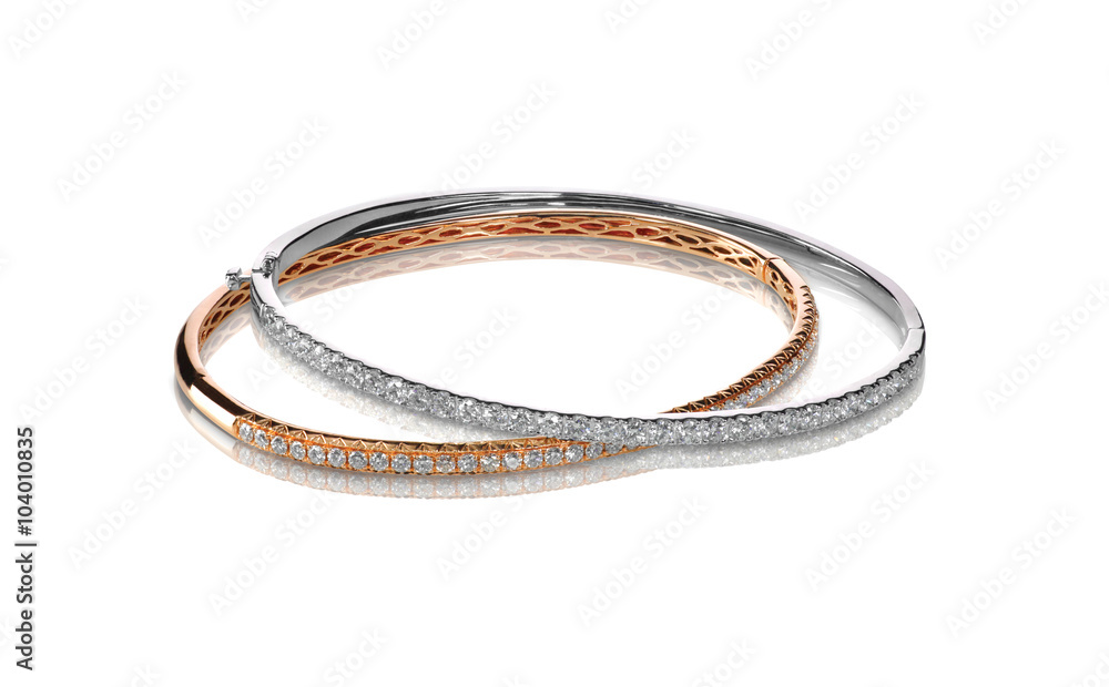 Set of diamond bracelets rose and white gold isolated on white with a shadow and reflection Set of diamond bracelets rose and white gold isolated on white with a shadow and reflection