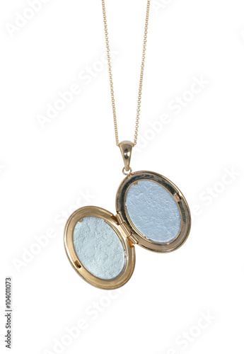 Empty gold vintage locket on a chain open