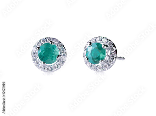 Round emerald diamond stud earrings in a halo setting isolated on white