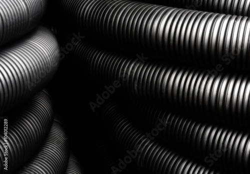 Wallpaper Mural Flexible, black, one above the other lying plastic pipes Torontodigital.ca