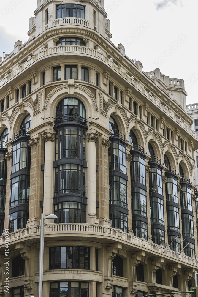 characteristic buildings on the street Gran Via in Madrid, capit