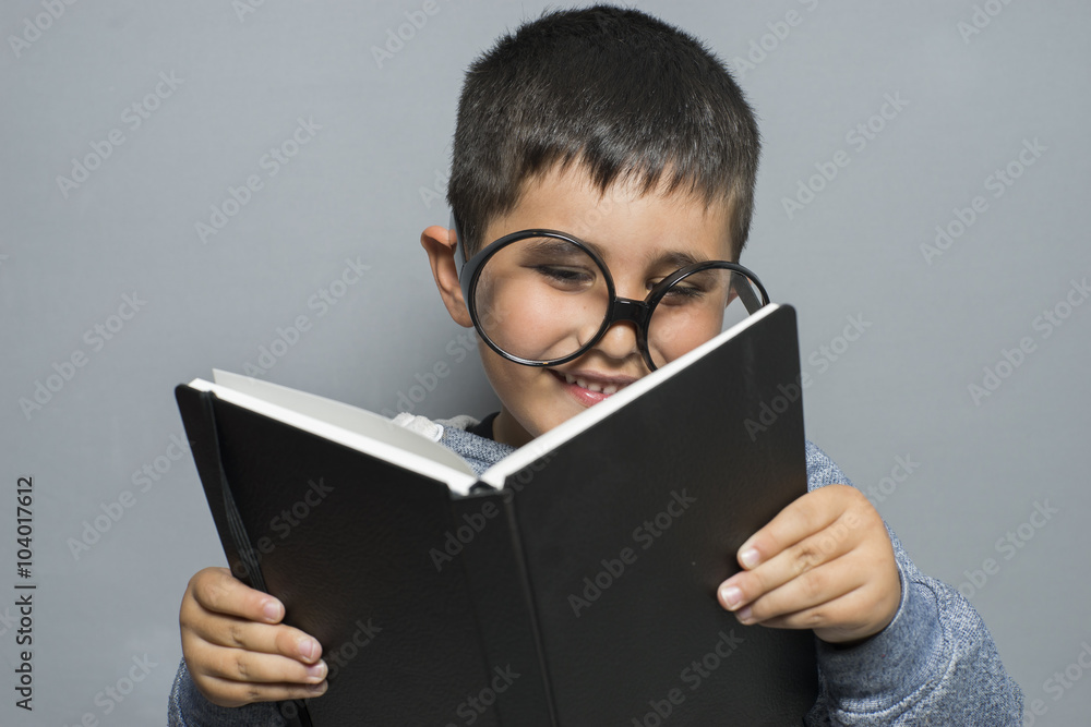 learning, dark-haired young student reading a funny book, readin learning, dark-haired young student reading a funny book, readin