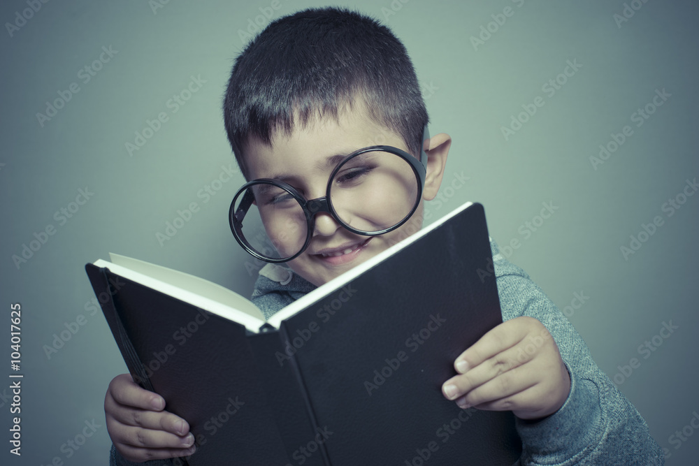 studio, dark-haired young student reading a funny book, reading studio, dark-haired young student reading a funny book, reading