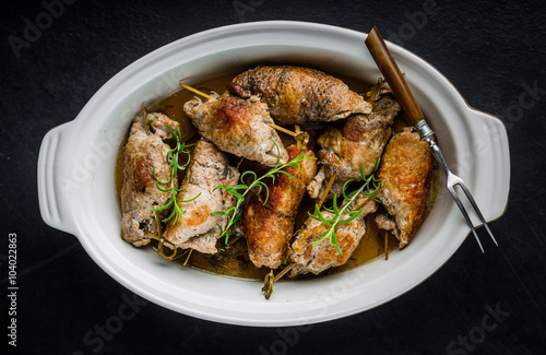 Pork rolls on porcelain dish