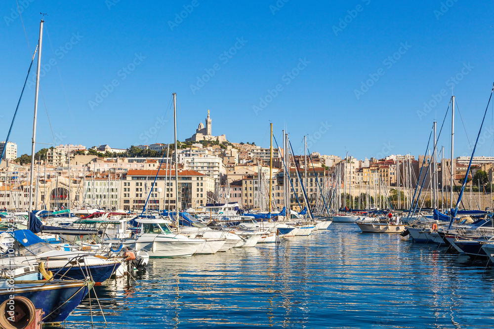 Marseille. View of Old Port. In the background, the Basilica of Notre-Dame de la Garde