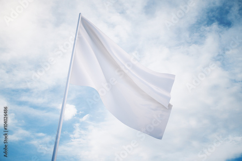 Waving white flag on a sky background, mock up