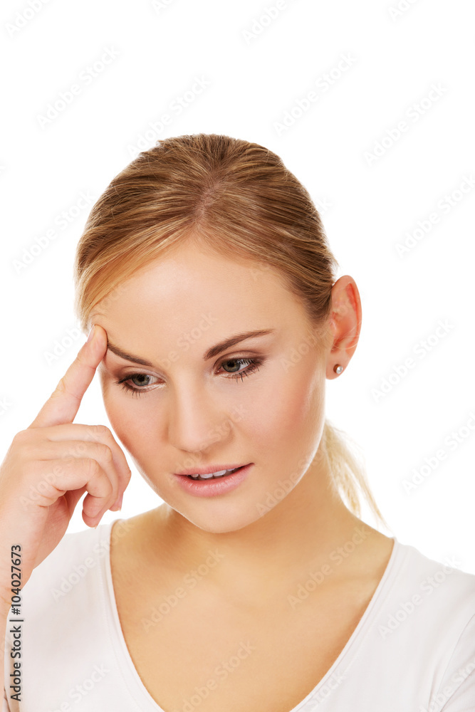 Pensive young woman thinking about something Pensive young woman thinking about something