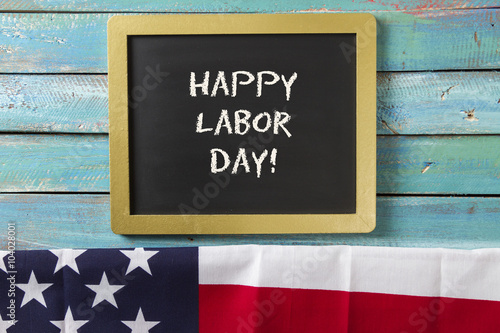 Labor Day chalk sign on blue wood background