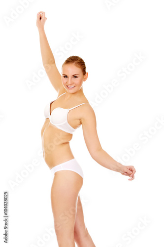 Beautiful slim woman in white underwear © Piotr Marcinski