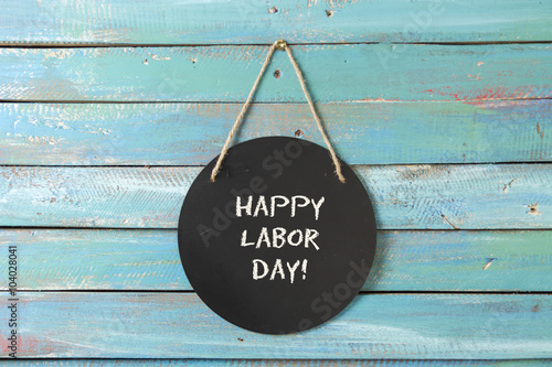 Labor Day chalk sign on blue wood background