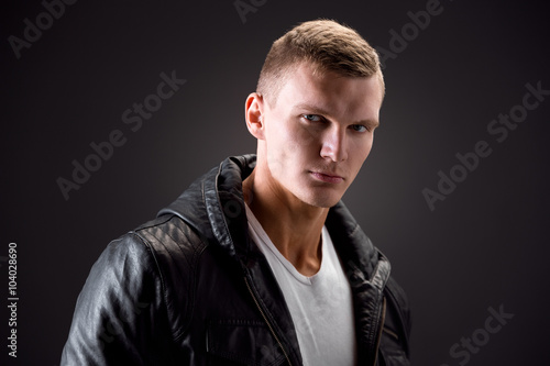 Фотография Strong Image of a very Tough Man on Black