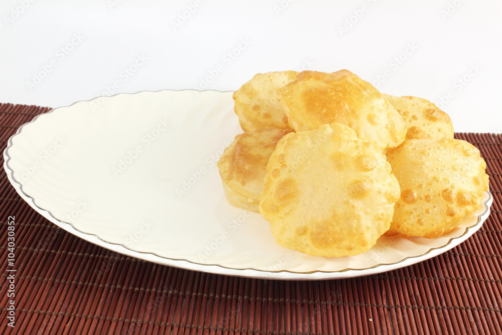puri or Poori traditional indian homemade deep fried bread or chapati puri or Poori traditional indian homemade deep fried bread or chapati