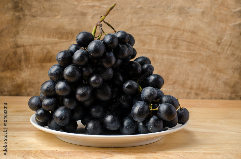 Seedless grape on wooden background Seedless grape on wooden background