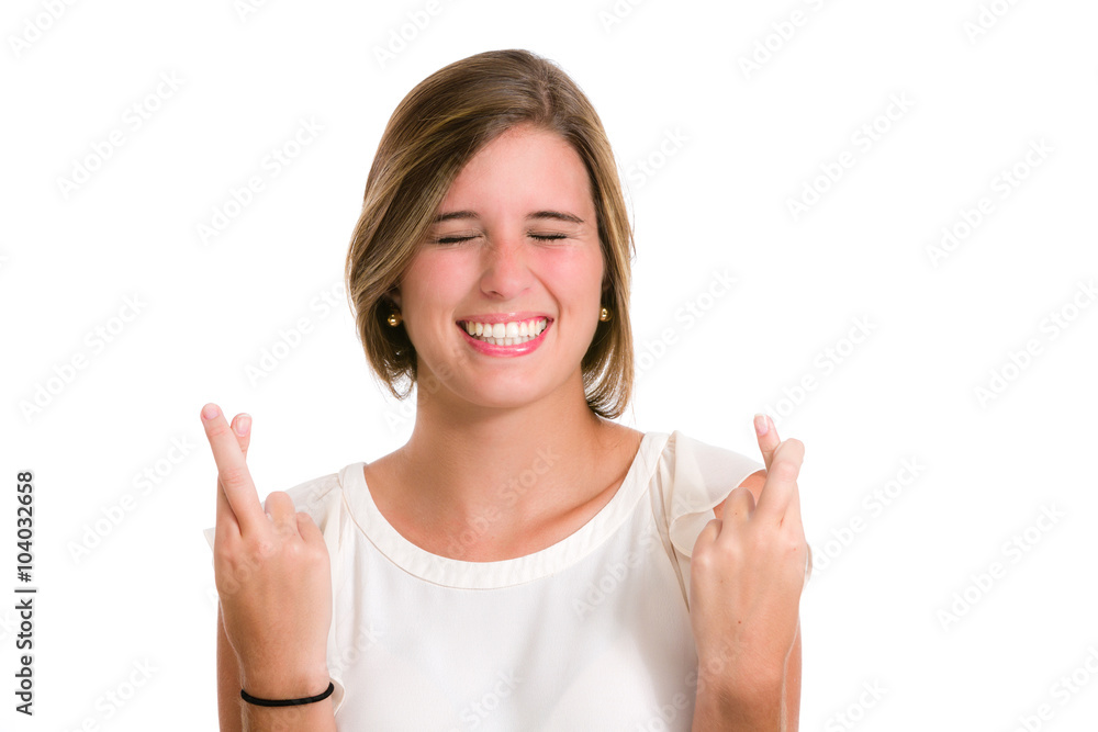 Hispanic young woman wishing luck with fingers crossed Hispanic young woman wishing luck with fingers crossed