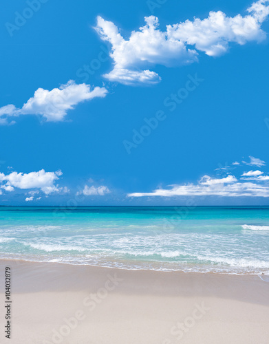 Turquoise waters and gentle waves of a white sand Caribbean beac