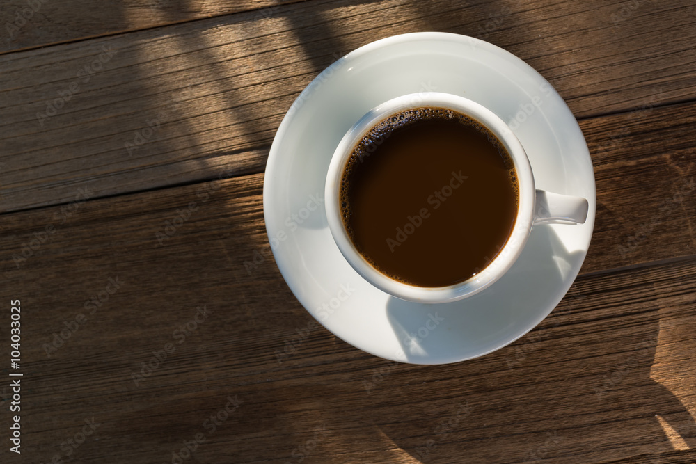 Cup of coffee on wooden table Cup of coffee on wooden table