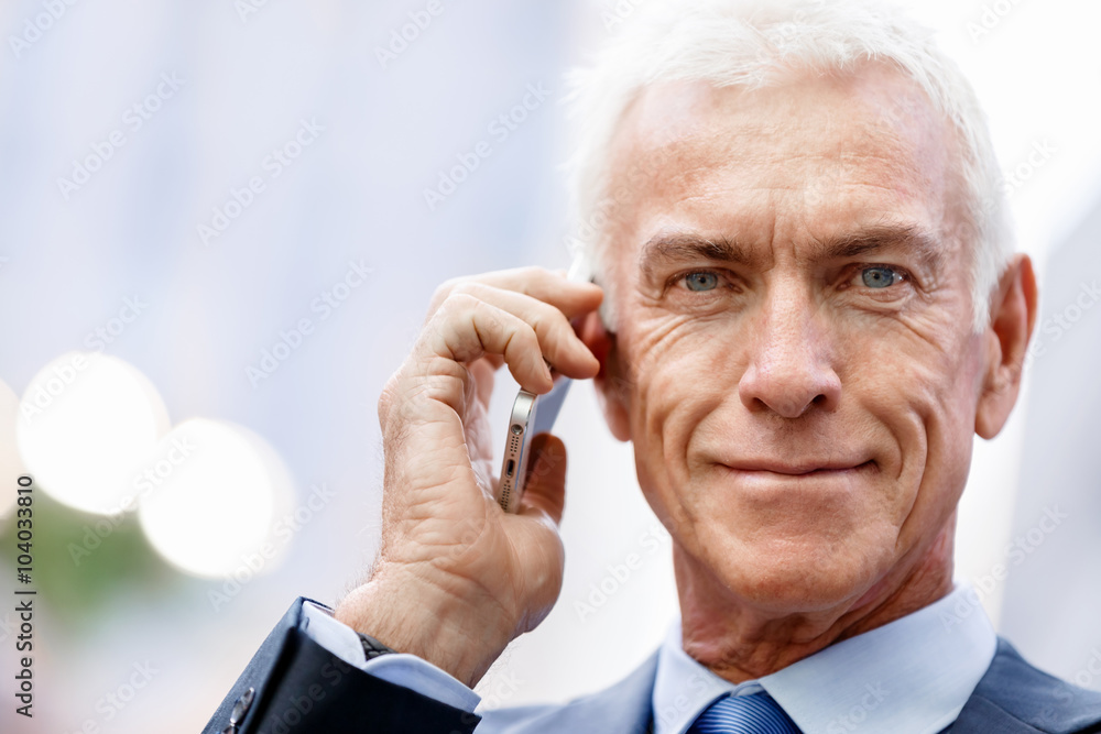 Portrait of confident businessman outdoors