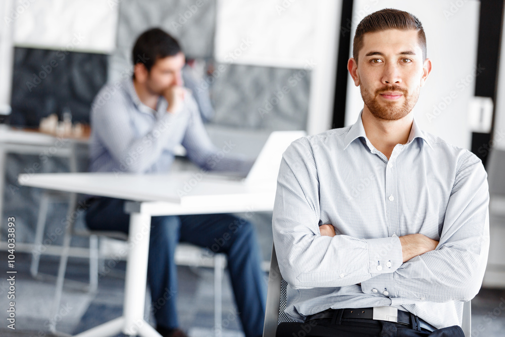 Attractive office worker sitting at desk Attractive office worker sitting at desk