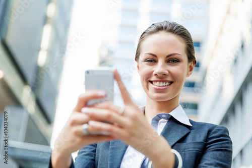 Portrait of business woman smiling outdoor © Sergey Nivens