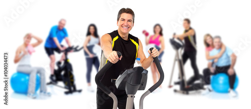 Man exercising on elliptical trainer.