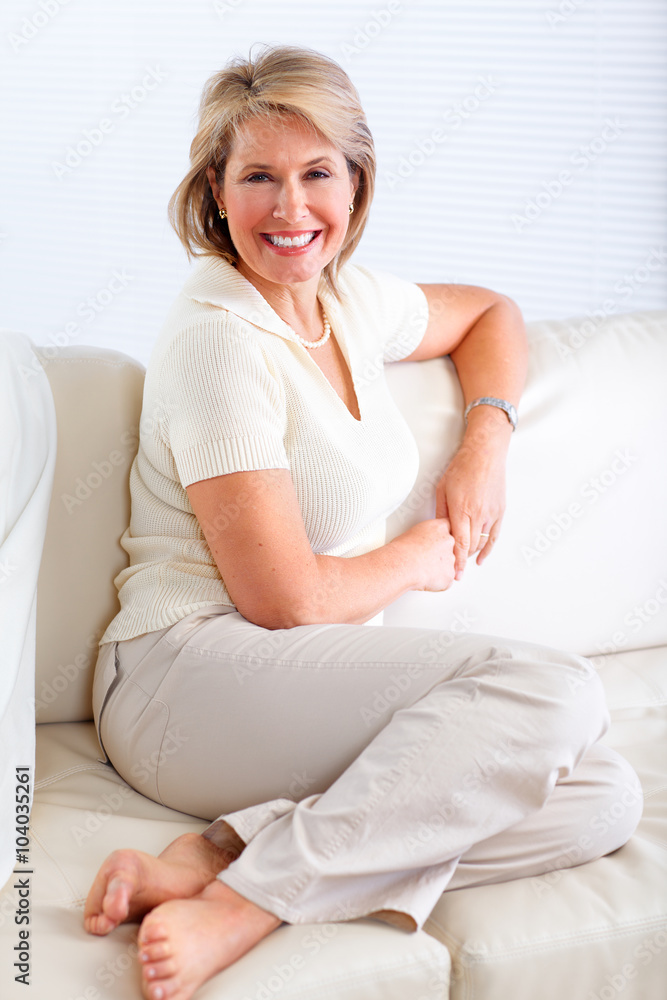 Senior woman relaxing in modern apartment. Senior woman relaxing in modern apartment.