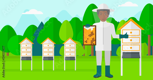 Bee-keeper at apiary.