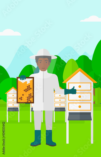 Bee-keeper at apiary.