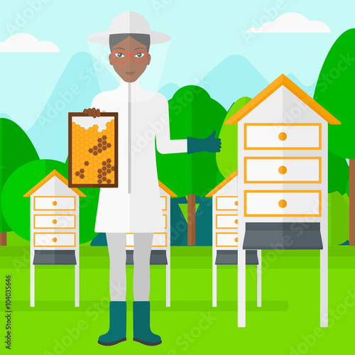 Bee-keeper at apiary.