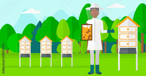 Bee-keeper at apiary.