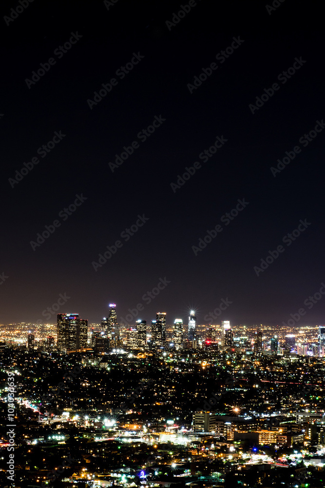 Long exposure night view of Los Angeles downtown and surrounding metropolitan area