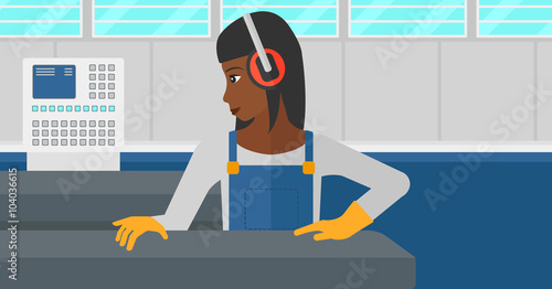 Woman working on steel-rolling mill.
