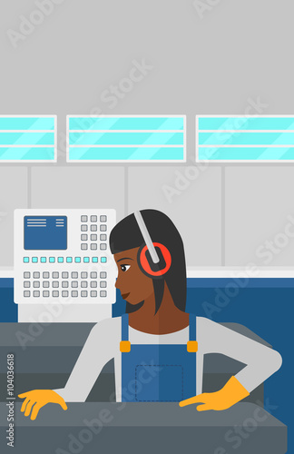 Woman working on steel-rolling mill.