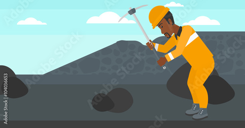 Miner working with pick.