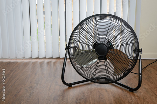 big ventilation fan on wooden floor
