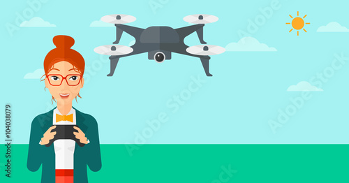 Woman flying drone.
