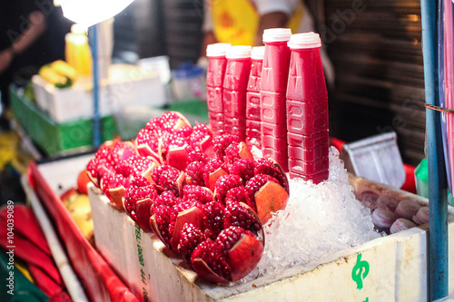Shop Bottled pomegranate juice at night in china town (Yaowarach) walking street Bangkok.,Thailand.