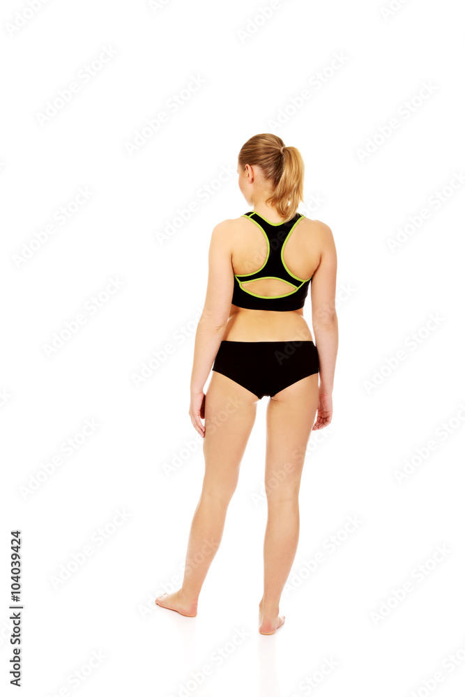 Back view of young athletic woman in sports underwear Back view of young athletic woman in sports underwear