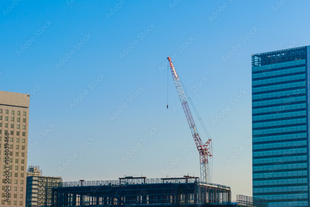 Crane and building construction site