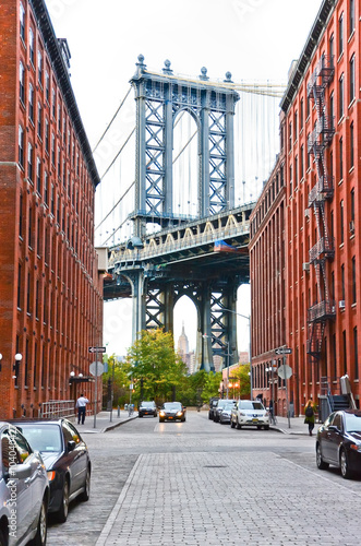 Manhattan Bridge seen between buildings in New York City