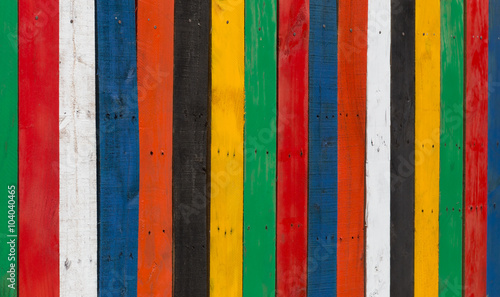 Multi-coloured stripped wooden fence