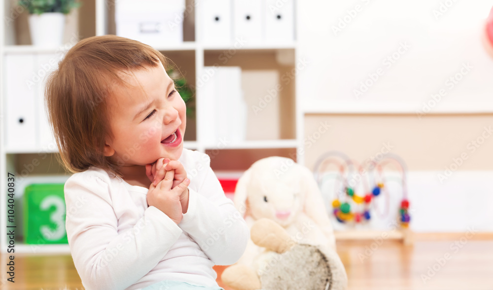 Happy toddler girl smiling in her house Happy toddler girl smiling in her house