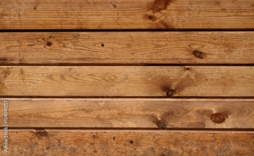 Wooden light-yellow background closeup