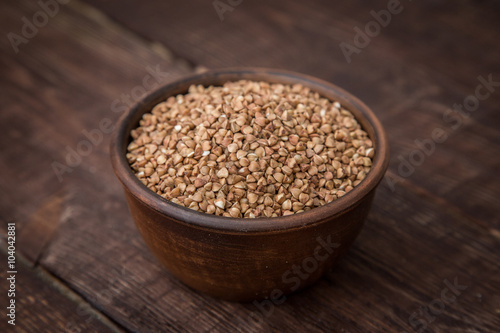 buckwheat groats on dark wooden table