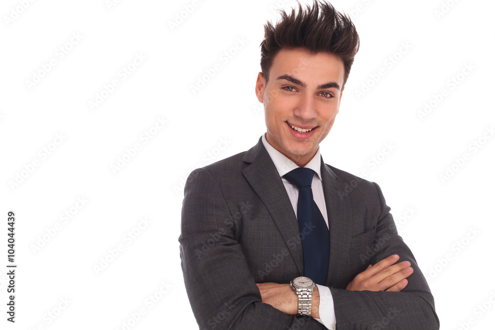 happy and relaxed young business man standing with hands crossed happy and relaxed young business man standing with hands crossed