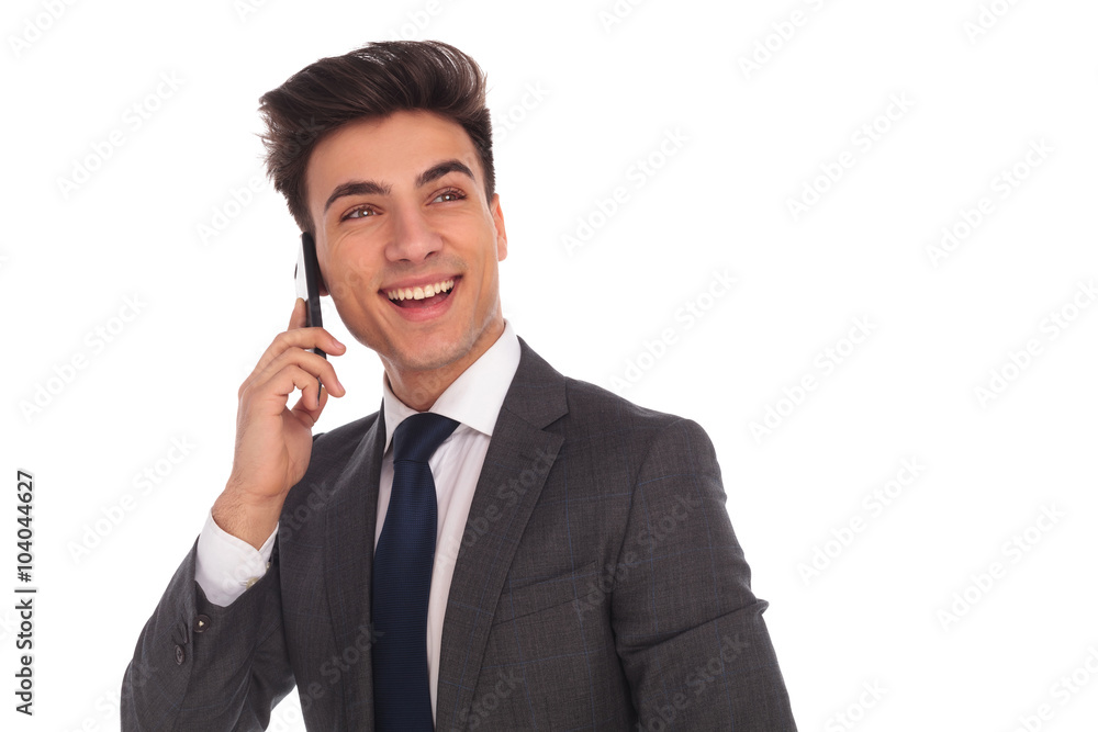 laughing young business man talking on the phone laughing young business man talking on the phone