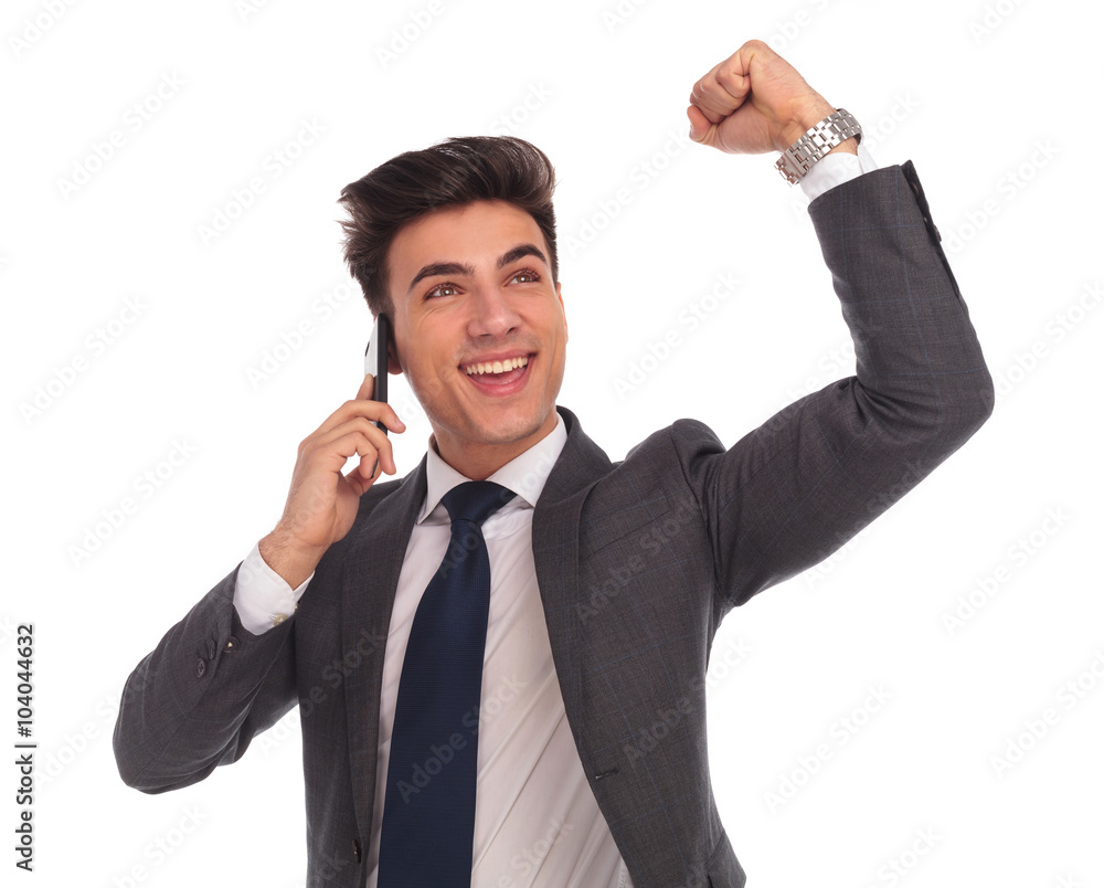 young business talking on the phone celebrating success young business talking on the phone celebrating success