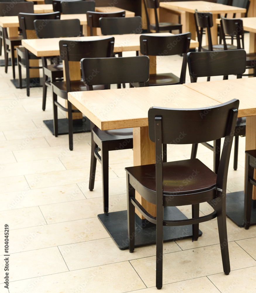 Restaurant furniture. Empty dining hall, fast food restaurant or canteen. Indoor shot with no people.